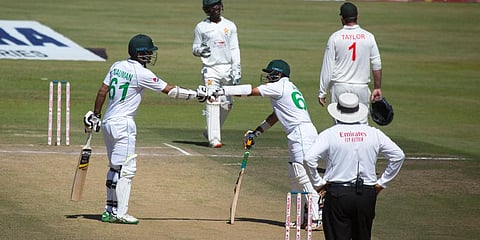 Pakistan batsman Nauman Ali, left, and Abid Ali gesture, during the second Test match against Zimbabwe at Harare Sports Club. (Photo | AP)