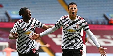 Manchester United's Mason Greenwood (R) celebrates after scoring his side's second goal during the English Premier League match against Aston Villa. (Photo | AP)