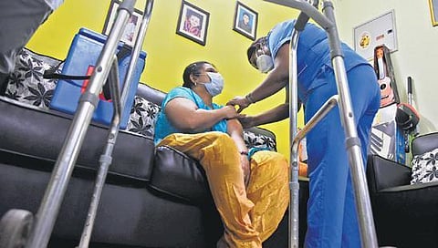 A disabled woman receiving vaccine at her home. (File photo | EPS/R Satish Babu)