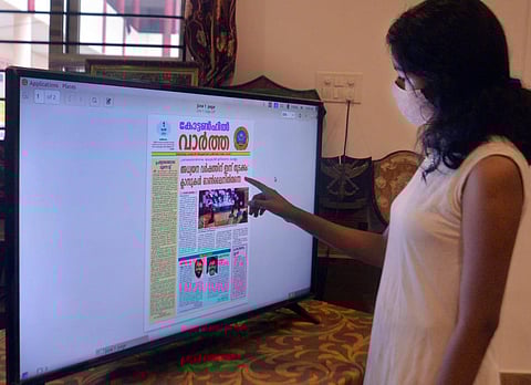  A student reading an e-paper of Government Cotton Hill HSS in an online class at the school office in Thiruvananthapuram. (Photo | EPS/Vincent Pulickal)