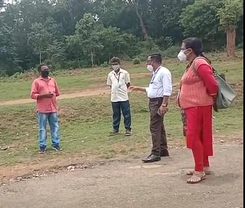 Officials trying to convince the tribal head (Photo | Special arrangement)