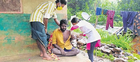 A tribal resident being vaccinated in Attappadi