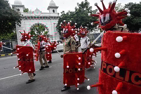 Hyderabad City Police personnel equipped with coronavirus-themed helmets, shields and maces, organised a programme to create awareness on Covid-19 in front of the Assembly. (Photo | Vinay Madapu, EPS)
