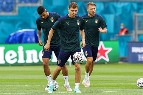 Italy's Emerson Palmieri, Nicolo Barella and Ciro Immobile, from left, work out during a training session of the national soccer team at the Olympic stadium in Rome. (Photo | AP)