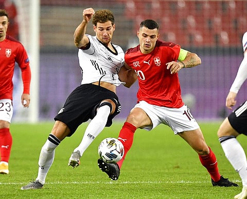 In this Tuesday, Oct. 13, 2020 filer, Germany's Leon Goretzka, left, Switzerland's Granit Xhaka compete for the ball during the UEFA Nations League soccer match. (Photo | AP)