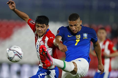 Brazil's Richarlison, right, and Paraguay's Roberto Rojas battle for the ball during a qualifying soccer match for the FIFA World Cup Qatar 2022. (Photo | AP)