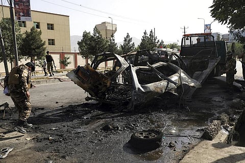 Afghan security personnel inspect the site of a bomb explosion in Kabul, Afghanistan. (Photo | AP)