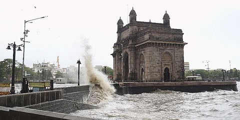Sea waves crash ashore near the Gateway of India during high tide in Mumbai. (Photo | PTI)