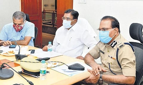 Agriculture Minister S Niranjan Reddy and DGP M Mahender Reddy at a meeting in Rangareddy on Saturday