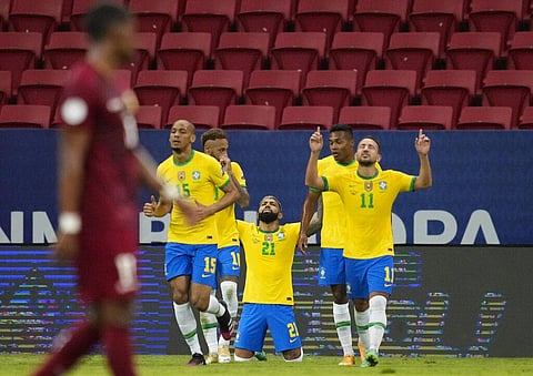 Brazil's Gabriel Barbosa, center, celebrates scoring his side's third goal against Venezuela during a Copa America soccer match at the National Stadium in Brasilia. (Photo | AP)