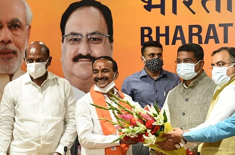 Former Telangana Minister Eatala Rajender joins BJP in the presence of Union Ministers Dharmendra Pradhan and G Kishan Reddy in New Delhi on Monday. (Photo | Shekhar Yadav, EPS)