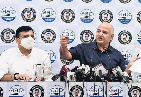 Manish Sisodia and AAP MP Sanjay Singh address the media at party office in New Delhi on Monday. (Photo | Parveen Negi/EPS)