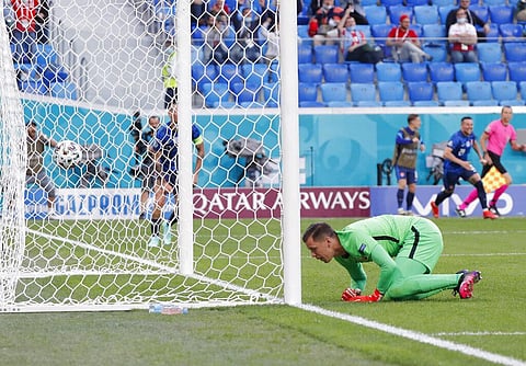 Poland's goalkeeper Wojciech Szczesny reacts after Slovakia's Milan Skriniar scoring his side's second goal during the Euro 2020 soccer championship group E match. (Photo | AP)