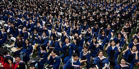 Nearly 11000 graduates attend a graduation ceremony at Central China Normal University in Wuhan, in China's central Hubei province. (File photo| AFP)