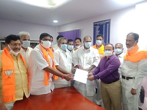 Selvam handing over his nomination papers to the Assembly Secretary R Mounissamy along with Chief Minister N Rangasamy and BJP legislative party leader A Namassivayam (Photo | Special arrangement)