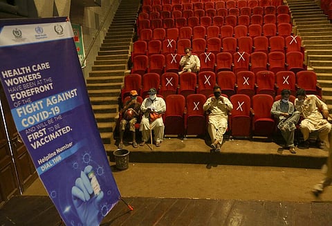Government employees wait their turn to receive the Convidecia COVID-19 vaccine at a vaccination center in Nishtar hall, in Peshawar, Pakistan. (Photo | AP)