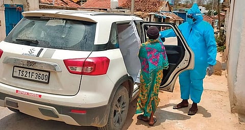 Thandriyala village sarpanch Gadila Ganga Prasad offers a Covid patient a ride to the hospital in his car, in Kathalapur mandal of Jagtial district