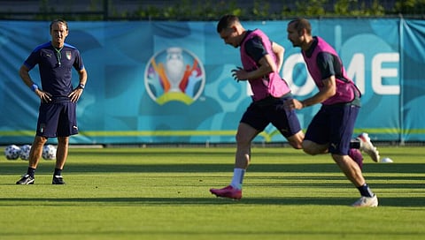 Italy's manager Roberto Mancini, left, looks at players practicing during a training session at Rome's Acqua Acetosa training center. (Photo | AP)