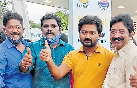 Scribe Raghu Jangi in the yellow t-shirt