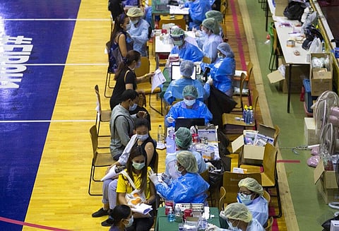 A health worker administers a dose of the Sinovac COVID-19 vaccine to a woman at Japan Bangkok Youth Center in Bangkok, Thailand. (Photo | AP)