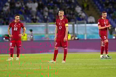 From left, Turkey's Kaan Ayhan, Burak Yilmaz and Merih Demiral react after Italy's Lorenzo Insigne scored his side's third goal. (Photo | AP)