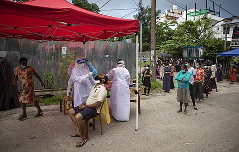 Sri Lankan health officials collect swab samples from people to test for the coronavirus in Colombo, Sri Lanka, Thursday, June 10, 2021. (Photo | AP)