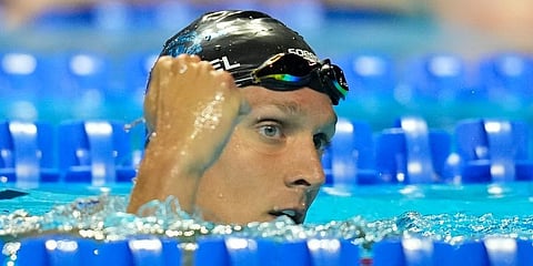 Caeleb Dressel reacts after winning his heat in the men's 100 freestyle during wave 2 of the US Olympic Swim Trials in Omaha. (Photo | AP)