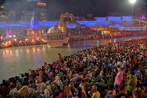 Devotees gather at Har Ki Pauri Ghat to offer prayers during Kumbh Mela 2021, in Haridwar. (File Photo | PTI)