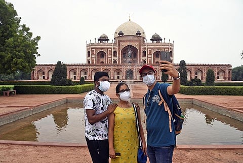 Vistors taking selfie in front of Humayun's Tomb in Delhi. (Photo | Parveen Negi, EPS)