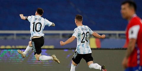 Argentina's Lionel Messi (L) celebrates scoring his side's opening goal against Chile during a Copa America match (Photo | AP)