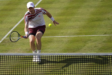 Andy Murray of Britain plays a return to Benoit Paire of France during their singles tennis match at the Queens Club tournament in London. (Photo | AP)