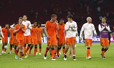 Netherlands' players celebrate at the end of the Euro 2020 soccer championship group C match between Netherlands and Austria. (Photo | AP)