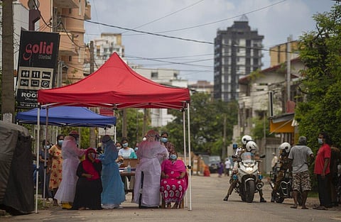 Sri Lankan health officials collect swab samples from people to test for the coronavirus in Colombo, Sri Lanka, Thursday, June 10, 2021. (Photo | AP)