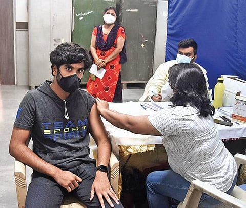 A beneficiary gets the Covid-19 vaccine at a govt school on Friday. (Photo | Parveen Negi/EPS)