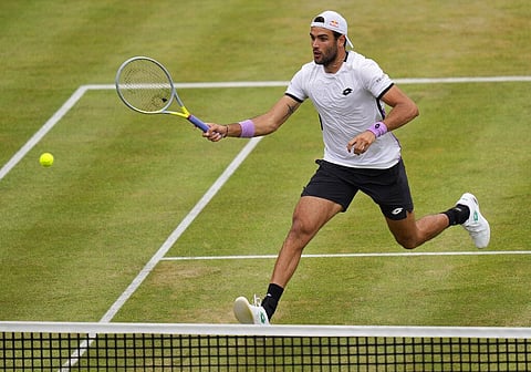Matteo Berrettini of Italy plays a return to Andy Murray of Britain during their singles tennis match at the Queen's Club tournament in London. (Photo | AP)