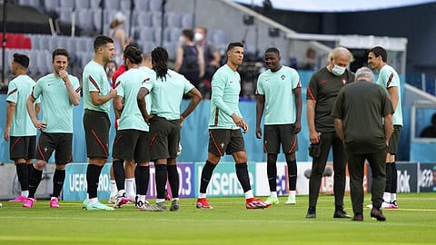 Portugal's Cristiano Ronaldo and his team mates arrive for a training session at the football arena stadium in Munich, Friday, June 18, 2021. (Photo | AP)