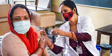 A beneficiary receives a dose of the COVID-19 vaccine. (Photo | PTI)