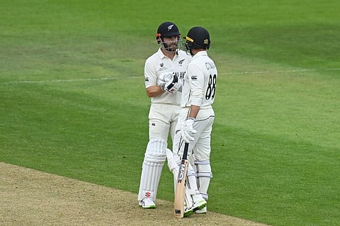 New Zealand's captain Kane Williamson (L) congratulates Devon Conway after he reaches his half century on 3rd day of WTC Final against India Ageas Bowl, Southampton, England. (Photo | AFP)