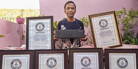 JNU computer operator Vinod Kumar Chaudhary holds nine Guinness World Records for typing skill, in New Delhi. (Photo | PTI)