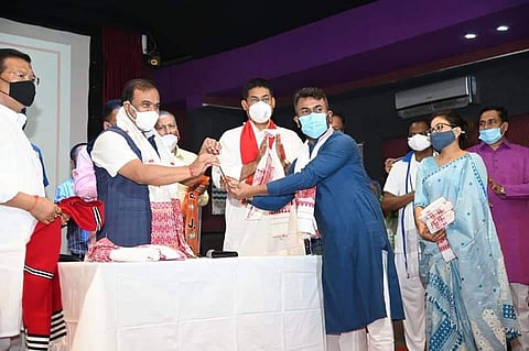 Chief Minister Himanta Biswa Sarma and others welcoming Rupjyoti Kurmi to party fold at a function in Guwahati on Monday. (Photo | Special arrangement)