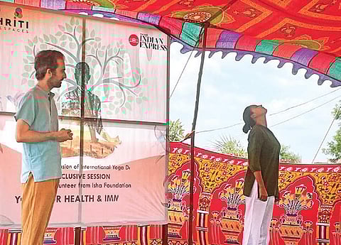 People take part in an introductory session on the basics of Isha Yoga organised by Dhriti Livespaces and The New Indian Express, at Zaheerabad in Sangareddy district, on Sunday