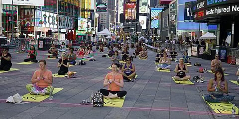 Over 3,000 people perform asanas on the occasion of International Yoga Day in New York. (Photo| ANI)
