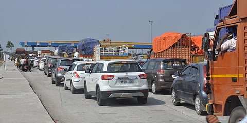 Vehicles stuck in long lines at toll plazas on Hyderabad-Vijayawada National Highway.
