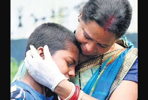 New Delhi native Anita hugs her son Monty, who had gone missing, in Kozhikode on Monday | T P Sooraj