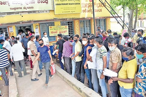 People wait to get inoculated outside a Covid-19 vaccination centre in Mysuru   on Wednesday | Udayshankar S