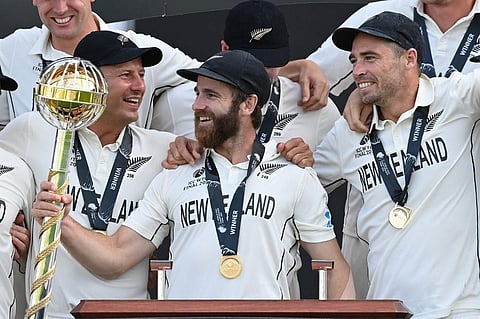 New Zealand's captain Kane Williamson (C) holds the winner's Mace as teammates celebrate winning World Test Championship at  Ageas Bowl, Southampton, England on June 23, 2021. (Photo | AFP)
