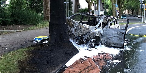 This by Police Bochum provided photo shows a destroyed police car at a tree in Bochum, Germany. (Photo | AP)