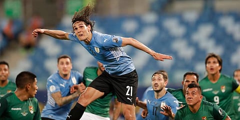 Uruguay's Edinson Cavani (C) heads the ball during a Copa America soccer match against Bolivia  (Photo | AP)