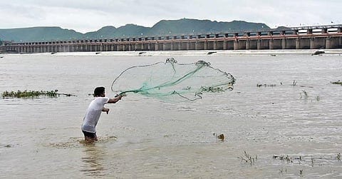 A fisherman casts his net in River Krishna. Image used for representational purposes