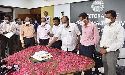 Chief Secretary Somesh Kumar cuts a cake to celebrate the State’s vaccination milestone, in Hyderabad. (Photo | EPS)